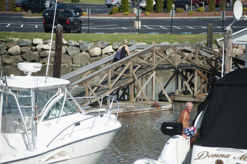 Neighbors, marina clash over free boat slips, temporary bridge